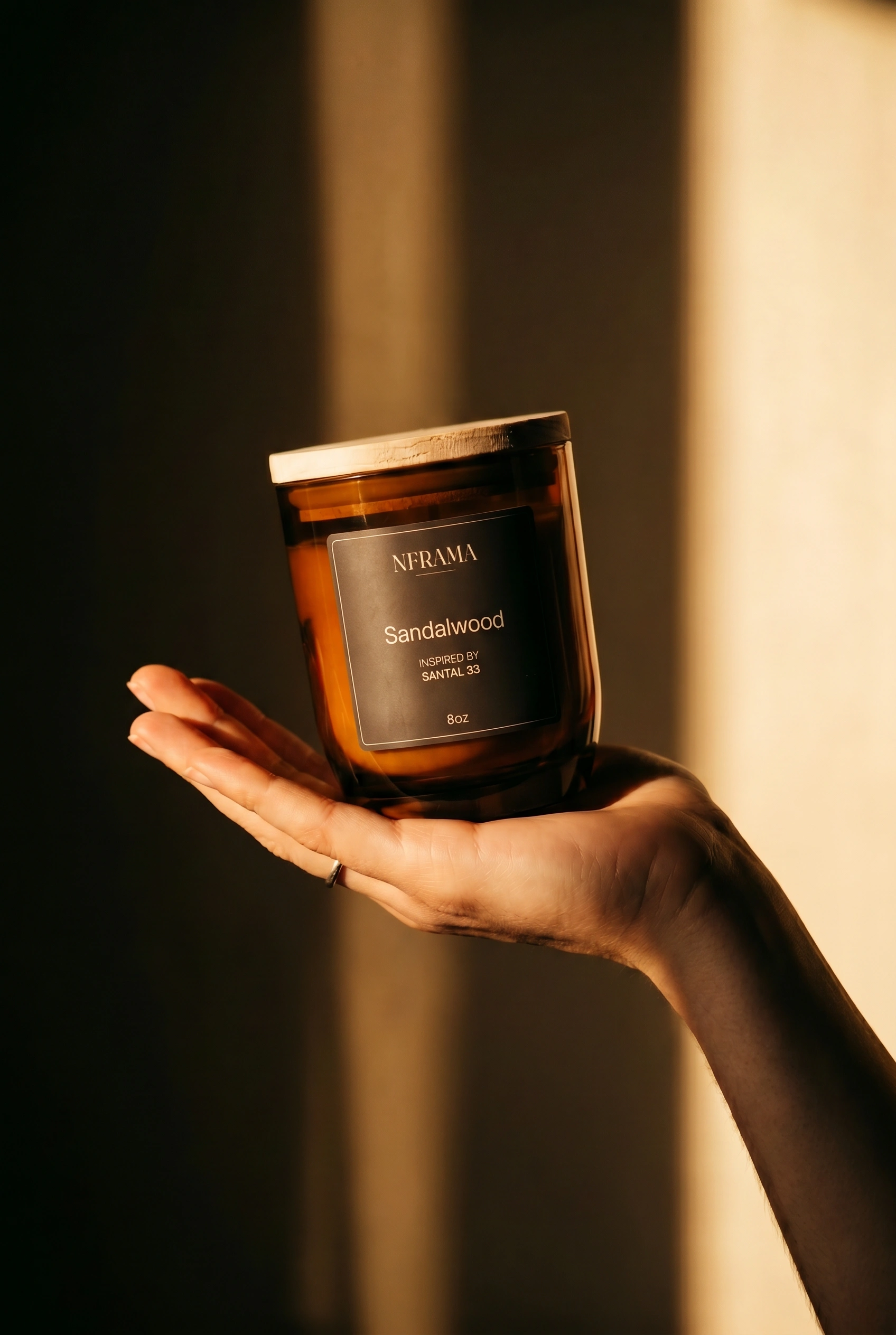 Sandalwood candle held in hand at golden hour