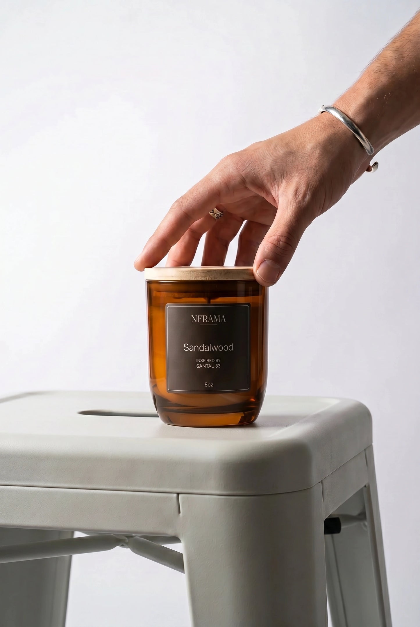 Reaching for the Sandalwood candle
